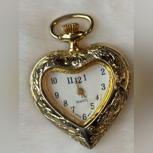 Vintage Women’s pendant watch,heart shape face/embossed unicorn back *working*